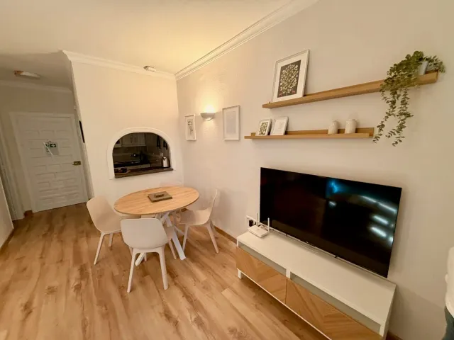 Premium one-bedroom apartment — Renovated dining area and smart TV