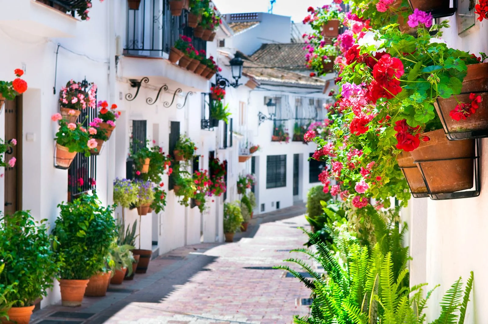 Whitewashed street and sea view in Benalmádena Pueblo
