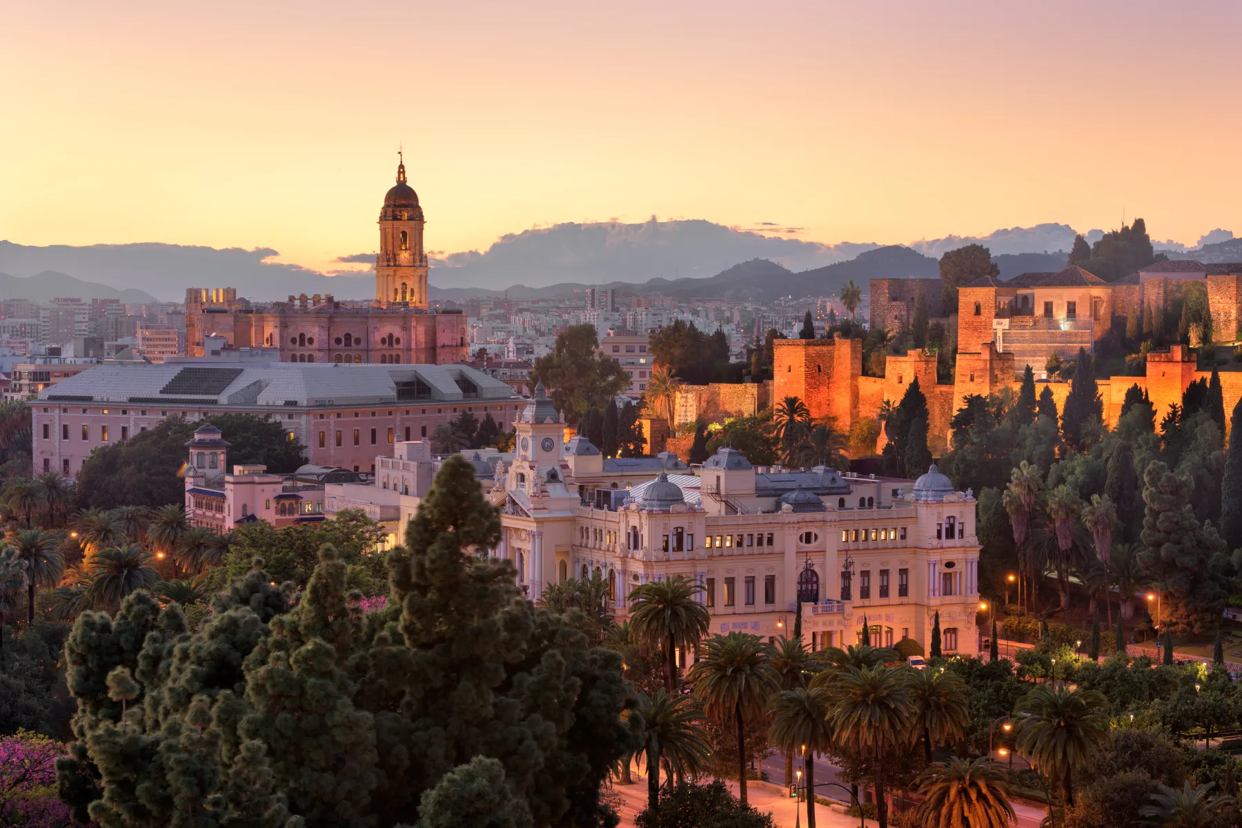 Málaga skyline and Alcazaba at sunset