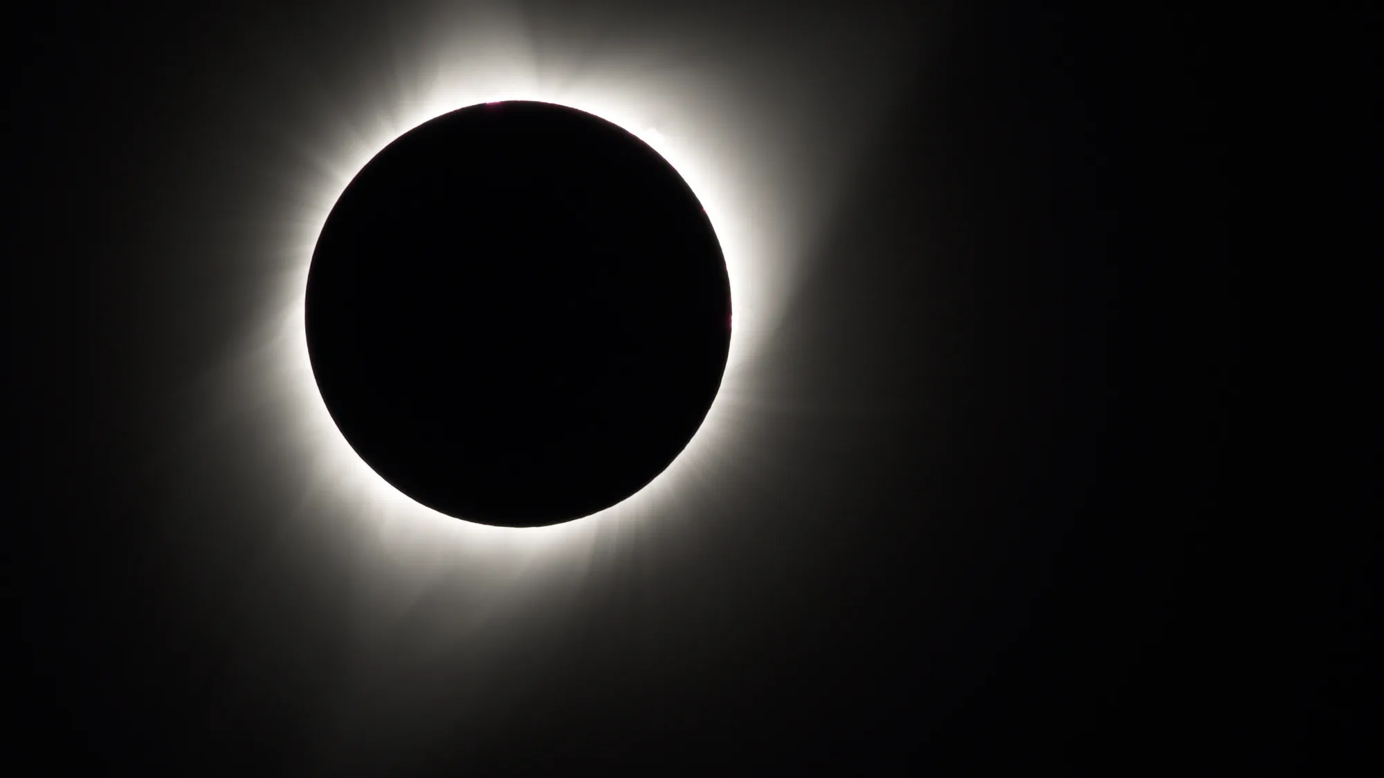 The Sun’s corona visible around the Moon during totality