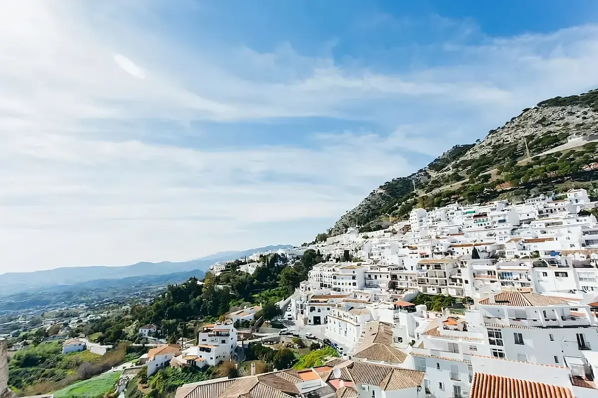 Whitewashed hillside homes of Mijas Pueblo overlooking the Andalusian countryside