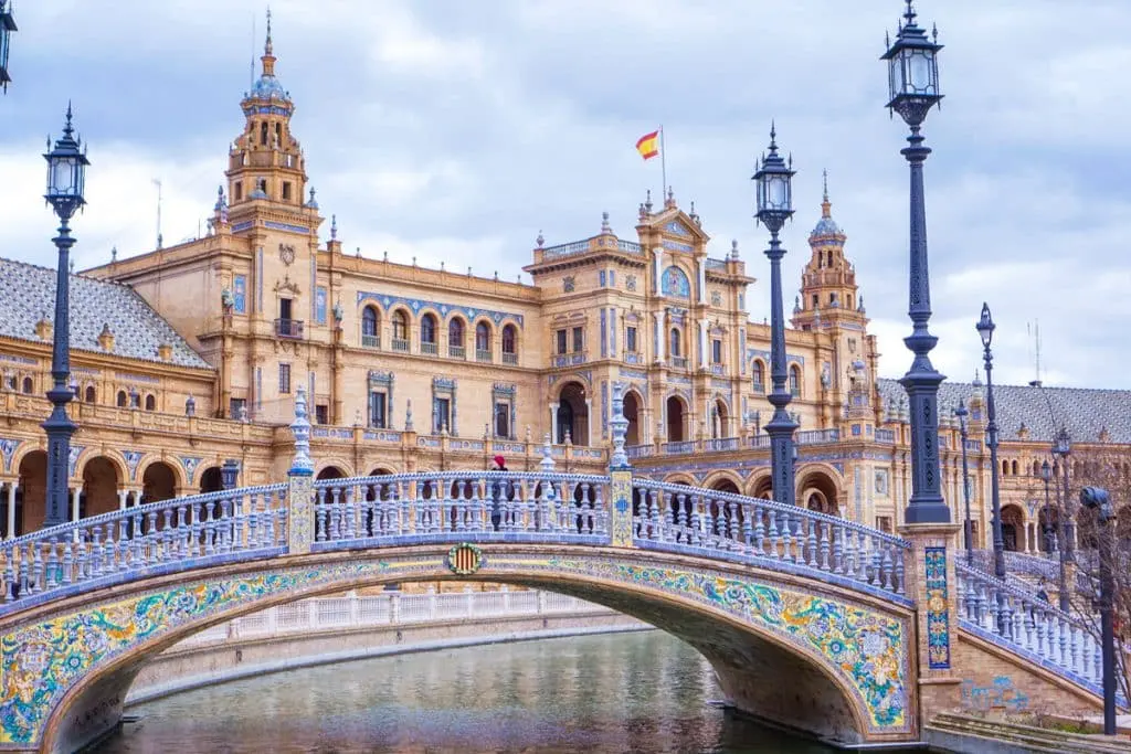 Plaza de España in Seville with its tiled bridge, canal and grand historic pavilion